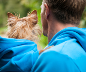 Dog dad wears matching hoodie with pet